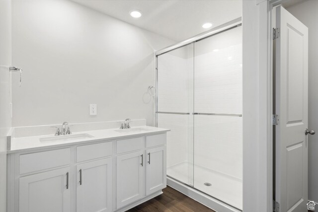 3509 N Gina St Unit 1230, Eagle Mountain, UT 84005 - full bathroom with a shower stall, recessed lighting, wood finished floors, and double vanity