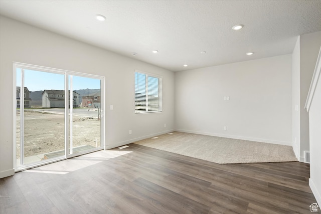 3509 N Gina St Unit 1230, Eagle Mountain, UT 84005 - spare room with wood finished floors and recessed lighting