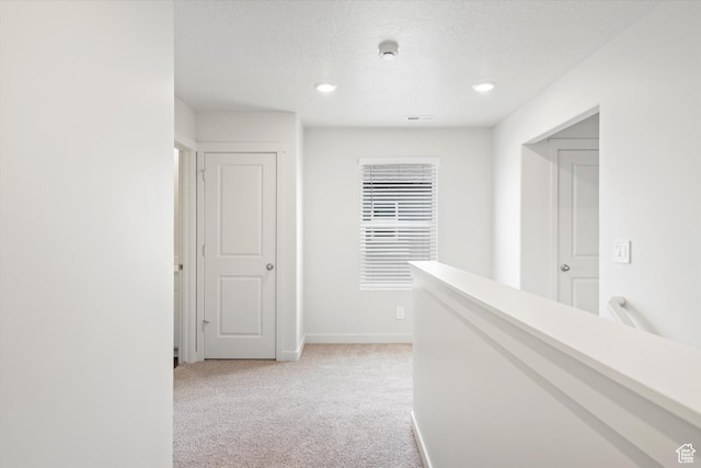3509 N Gina St Unit 1230, Eagle Mountain, UT 84005 - corridor featuring light carpet, recessed lighting, and a textured ceiling