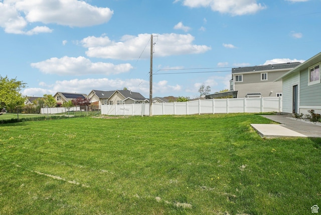 view of yard with fence and a patio