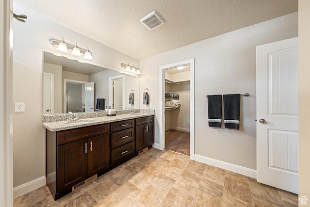 3030 N 125 E, Cedar City, UT 84721 - full bath with baseboards, a sink, visible vents, and double vanity