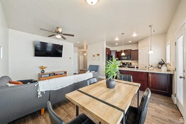 3030 N 125 E, Cedar City, UT 84721 - dining room with light wood-style floors, ceiling fan, baseboards, visible vents, and recessed lighting