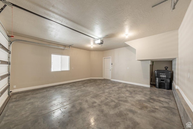 3030 N 125 E, Cedar City, UT 84721 - garage featuring baseboards and a garage door opener