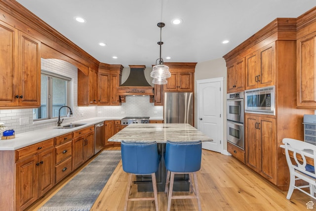 9470 N Canyon Heights Dr, Cedar Hills, UT 84062 - kitchen with brown cabinets, a sink, premium range hood, a kitchen island, and appliances with stainless steel finishes