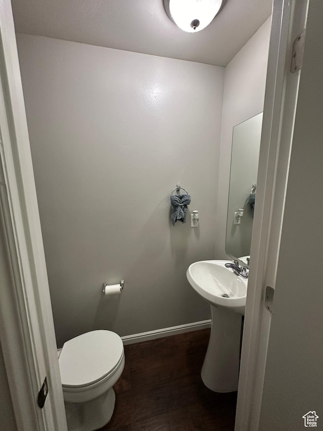 1688 N 80 E, Tooele, UT 84074 - bathroom featuring baseboards, wood finished floors, a sink, and toilet