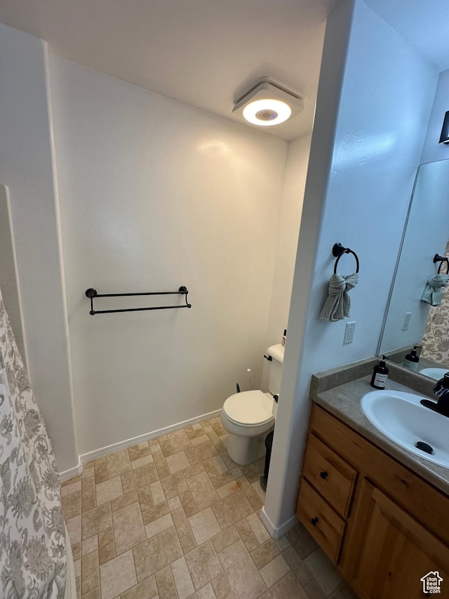 1688 N 80 E, Tooele, UT 84074 - bathroom featuring stone finish flooring, toilet, and vanity