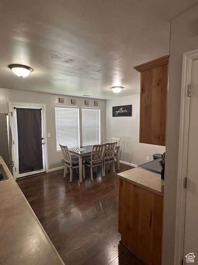 1688 N 80 E, Tooele, UT 84074 - dining area with baseboards and dark wood-style floors