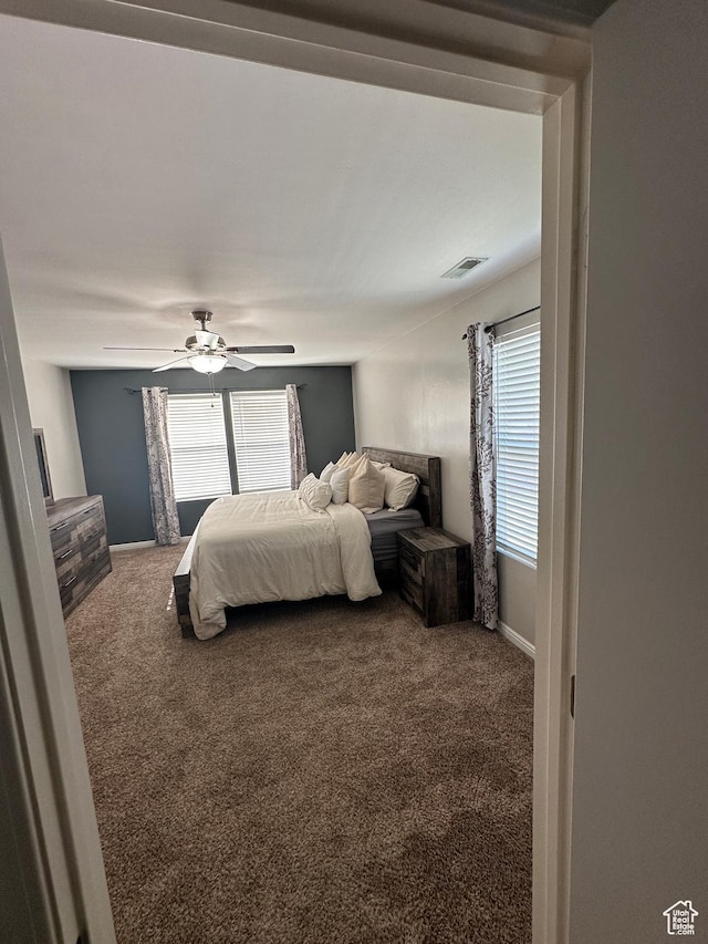 1688 N 80 E, Tooele, UT 84074 - bedroom featuring visible vents, carpet flooring, a ceiling fan, and multiple windows