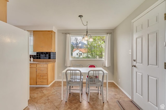 831 S 50 W, Orem, UT 84058 - dining room featuring baseboards and a chandelier