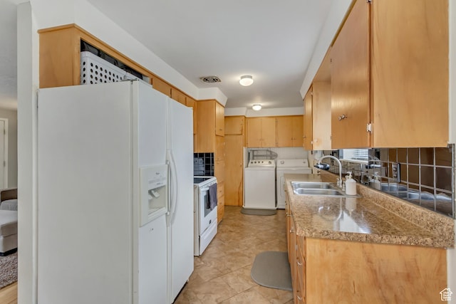 831 S 50 W, Orem, UT 84058 - kitchen with a sink, tasteful backsplash, washing machine and dryer, visible vents, and white appliances