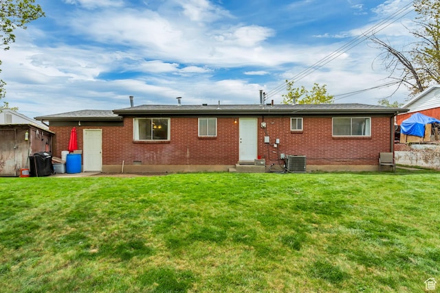 831 S 50 W, Orem, UT 84058 - rear view of property featuring a storage shed, entry steps, brick siding, and a yard