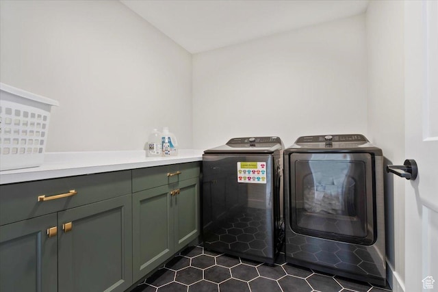 314 W Founders Blvd S, Saratoga Springs, UT 84045 - laundry area with cabinet space, dark tile patterned floors, and washer and clothes dryer