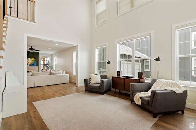 314 W Founders Blvd S, Saratoga Springs, UT 84045 - living room featuring ceiling fan, a high ceiling, wood finished floors, and baseboards