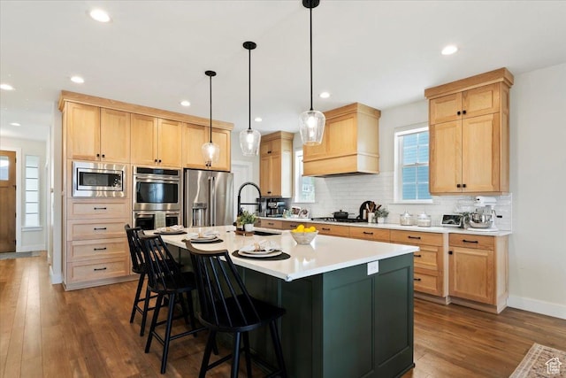 314 W Founders Blvd S, Saratoga Springs, UT 84045 - kitchen featuring a sink, light brown cabinetry, a breakfast bar, premium range hood, and appliances with stainless steel finishes