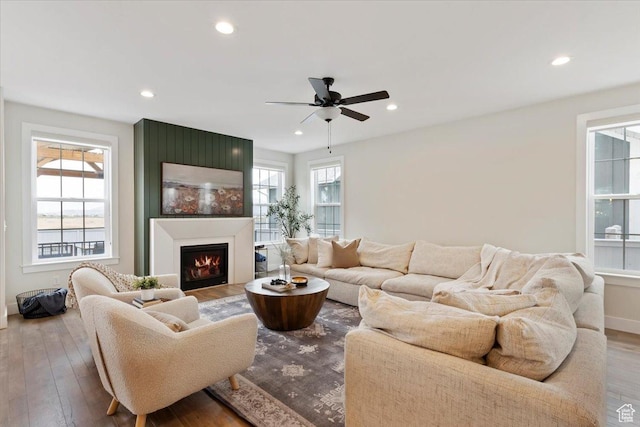 314 W Founders Blvd S, Saratoga Springs, UT 84045 - living area featuring baseboards, recessed lighting, wood finished floors, ceiling fan, and a lit fireplace