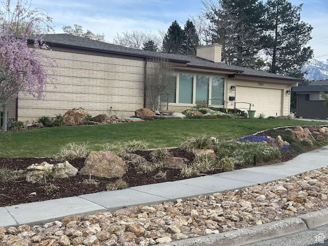 5843 S Fontaine Bleu Cir, Salt Lake City, UT 84121 - single story home with a chimney, a front lawn, brick siding, and a garage