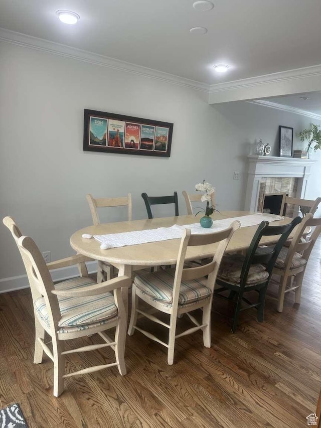 5843 S Fontaine Bleu Cir, Salt Lake City, UT 84121 - dining room featuring wood finished floors, a fireplace, and ornamental molding