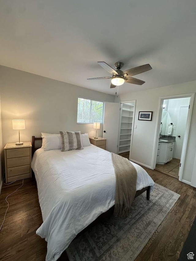 5843 S Fontaine Bleu Cir, Salt Lake City, UT 84121 - bedroom featuring baseboards, ensuite bathroom, wood finished floors, and ceiling fan