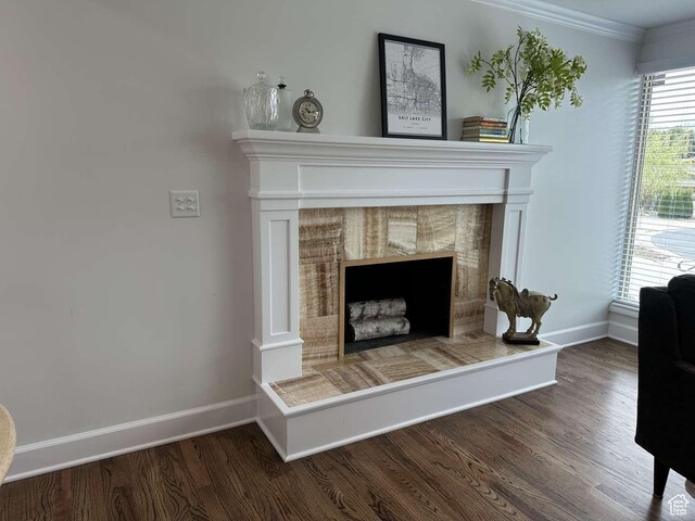 5843 S Fontaine Bleu Cir, Salt Lake City, UT 84121 - interior details with baseboards, a tiled fireplace, and wood finished floors