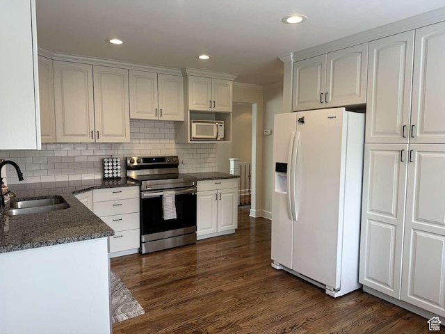 5843 S Fontaine Bleu Cir, Salt Lake City, UT 84121 - kitchen with dark wood finished floors, tasteful backsplash, a sink, and white appliances