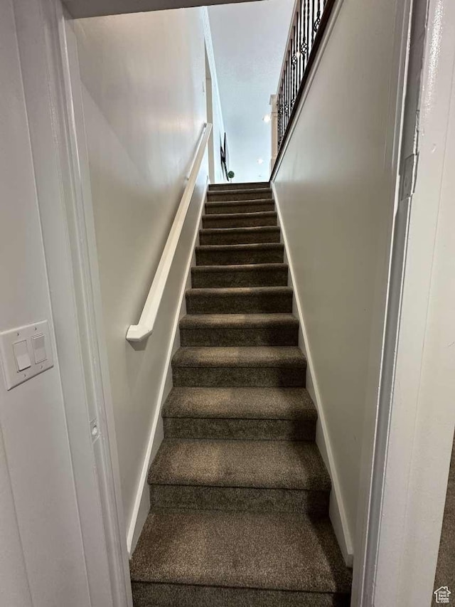 5843 S Fontaine Bleu Cir, Salt Lake City, UT 84121 - staircase featuring baseboards and carpet flooring
