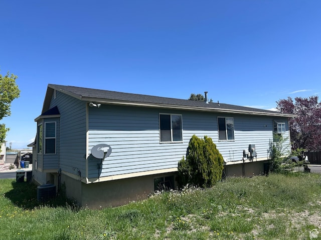 back of property with central AC