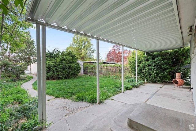 view of patio featuring fence