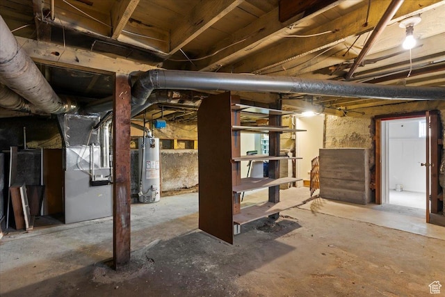 unfinished basement featuring water heater