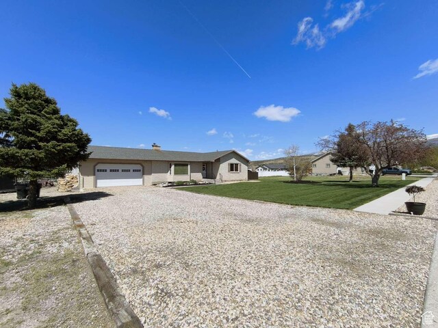 410 E 500 N, Ephraim, UT 84627 - ranch-style house featuring an attached garage, driveway, a chimney, and a front yard