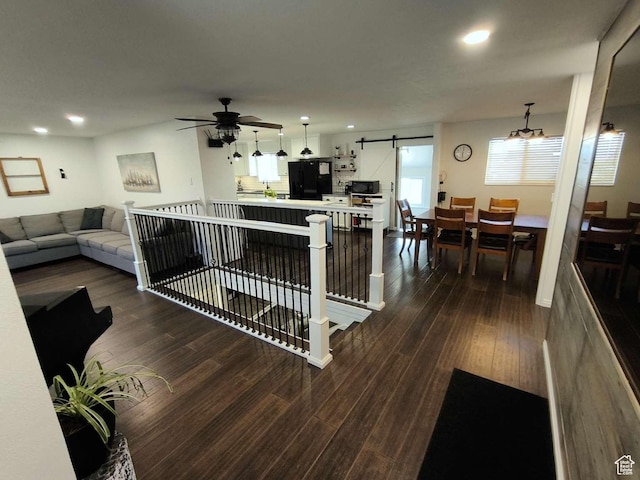 410 E 500 N, Ephraim, UT 84627 - living area featuring a barn door, dark wood-type flooring, and recessed lighting