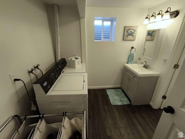 410 E 500 N, Ephraim, UT 84627 - laundry area featuring dark wood-style floors, washer and clothes dryer, a sink, baseboards, and laundry area