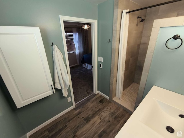 410 E 500 N, Ephraim, UT 84627 - full bath featuring a tile shower, baseboards, and wood finished floors