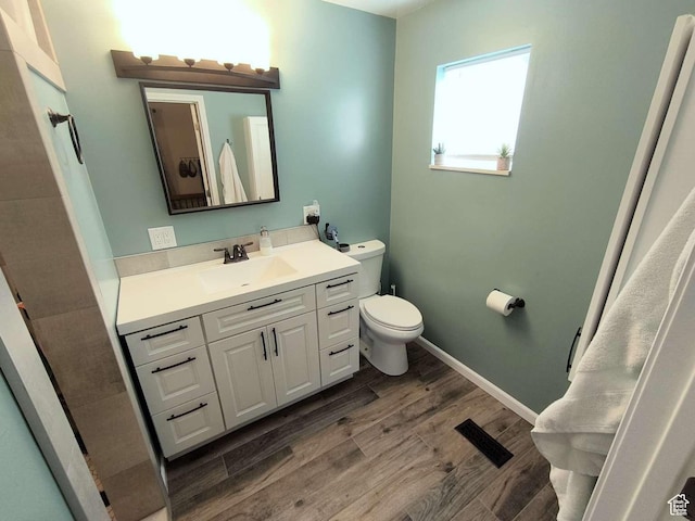 410 E 500 N, Ephraim, UT 84627 - bathroom with toilet, visible vents, baseboards, wood finished floors, and vanity