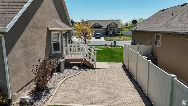 view of patio featuring fence