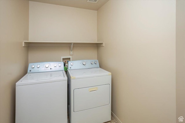 laundry area with visible vents, laundry area, and independent washer and dryer