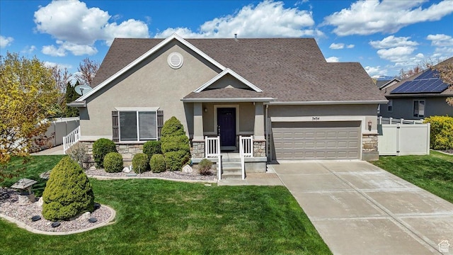 view of front of home featuring a front lawn, stucco siding, driveway, stone siding, and a garage