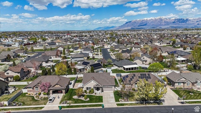 birds eye view of property with a mountain view and a residential view