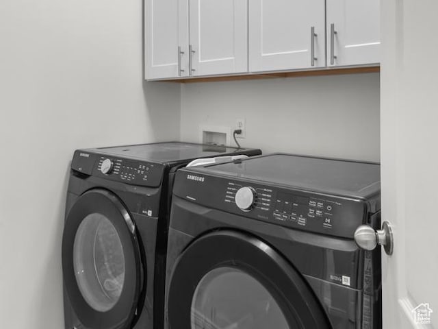 1962 E Meadow Downs Way S, Cottonwood Heights, UT 84121 - clothes washing area featuring washer and dryer and cabinet space