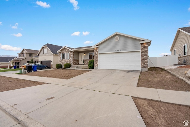 6263 W Oak Gate Dr, West Jordan, UT 84081 - ranch-style home with concrete driveway, an attached garage, fence, brick siding, and a residential view