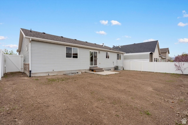 6263 W Oak Gate Dr, West Jordan, UT 84081 - back of property featuring a gate, a fenced backyard, and central AC unit