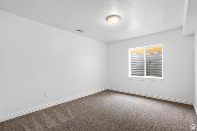 6263 W Oak Gate Dr, West Jordan, UT 84081 - carpeted spare room with a textured ceiling, visible vents, and baseboards