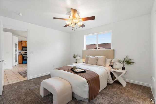6263 W Oak Gate Dr, West Jordan, UT 84081 - bedroom with ceiling fan, light carpet, light tile patterned flooring, and baseboards