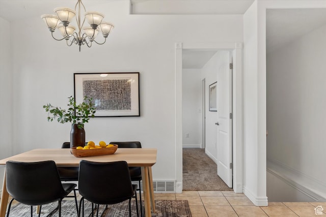 6263 W Oak Gate Dr, West Jordan, UT 84081 - dining area with light carpet, baseboards, a notable chandelier, and light tile patterned floors