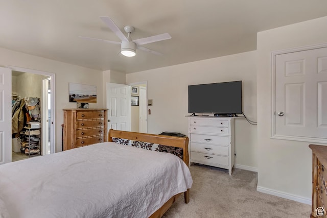 982 E 315 S, Orem, UT 84097 - bedroom with a walk in closet, light carpet, baseboards, and ceiling fan