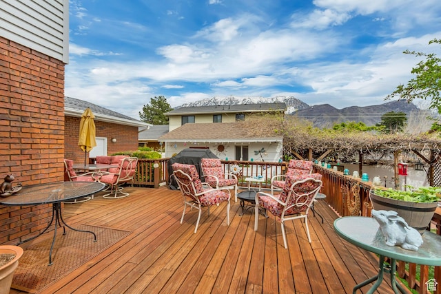 982 E 315 S, Orem, UT 84097 - wooden terrace with outdoor dining area, a mountain view, and outdoor lounge area