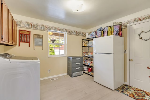 982 E 315 S, Orem, UT 84097 - laundry area featuring washer / dryer, cabinet space, visible vents, and baseboards