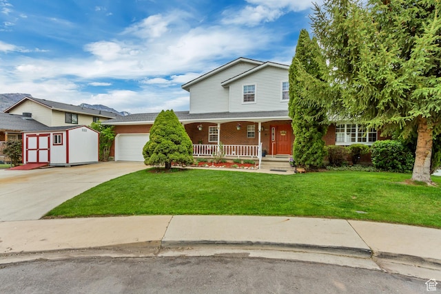 982 E 315 S, Orem, UT 84097 - traditional-style house with a front lawn, concrete driveway, an attached garage, a shed, and a porch