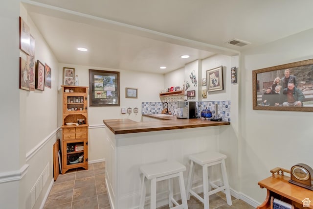 982 E 315 S, Orem, UT 84097 - bar with tasteful backsplash, a sink, visible vents, and recessed lighting