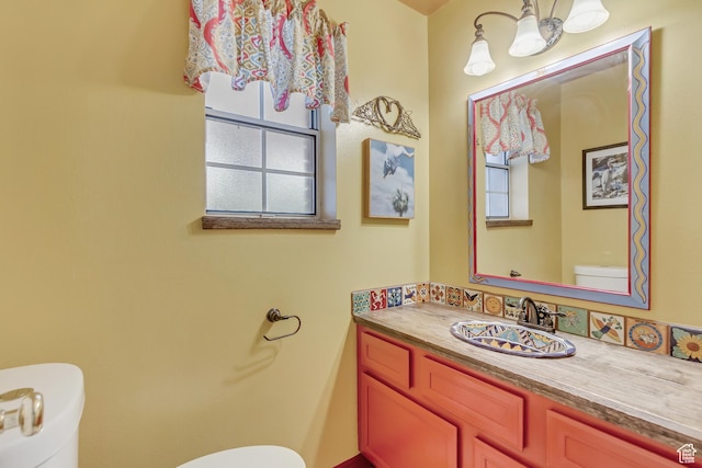 982 E 315 S, Orem, UT 84097 - half bathroom with toilet, a notable chandelier, and vanity