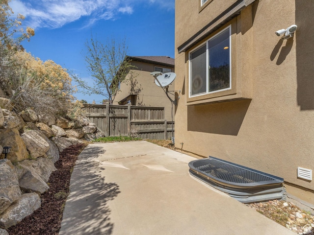 view of patio featuring fence